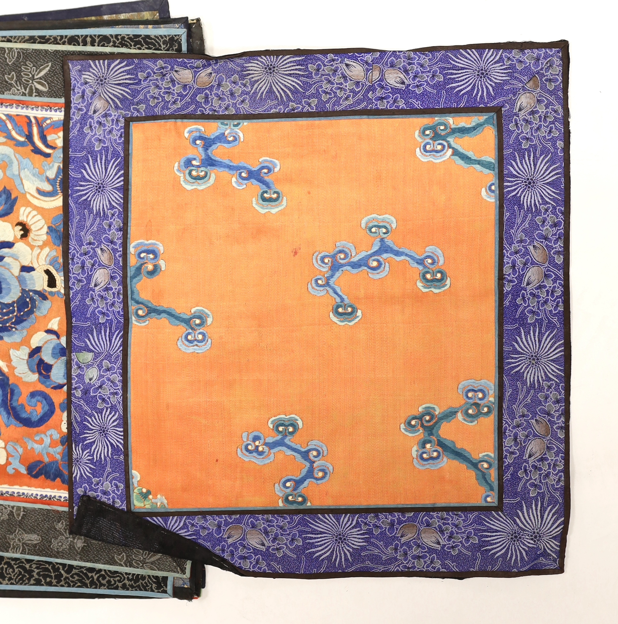 Nine Chinese silk embroidered panels, framed with silk damask borders, circa 20th century, largest 37cm x 41cm